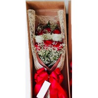 9 red and white roses in box