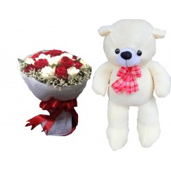 The  teddy bear size 1.20 meter with flowers (delivery in 2-3 day)